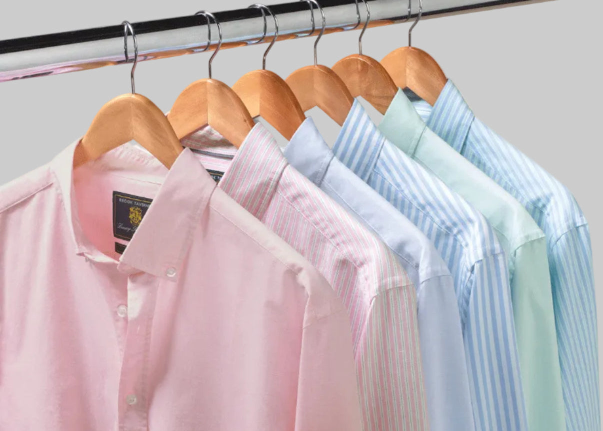 Brook Taverner shirts on wooden hangers at Bell and Sons, pink, blue striped and pale green